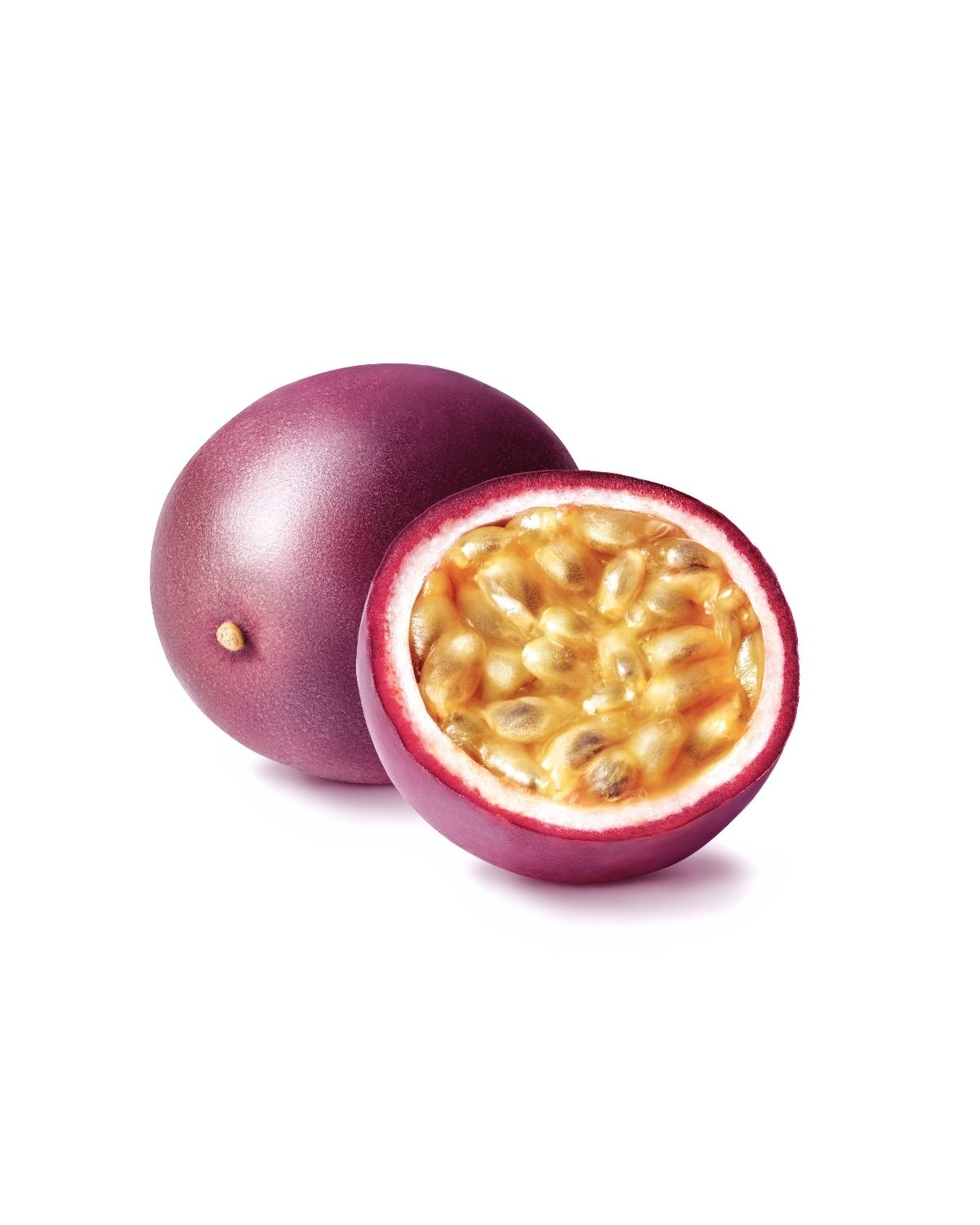 Whole passion fruit and a halved passion fruit showing golden pulp isolated on a white background