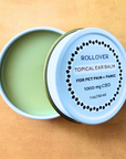 Open tin of CBD topical ear balm for pets labeled for pain and panic relief